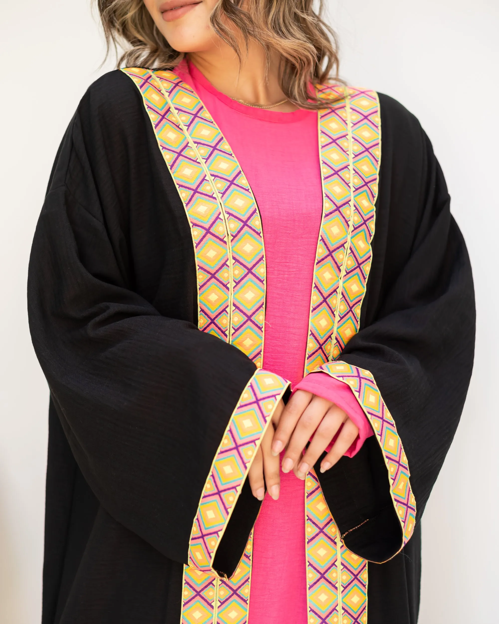 Black cloak with zigzag tape