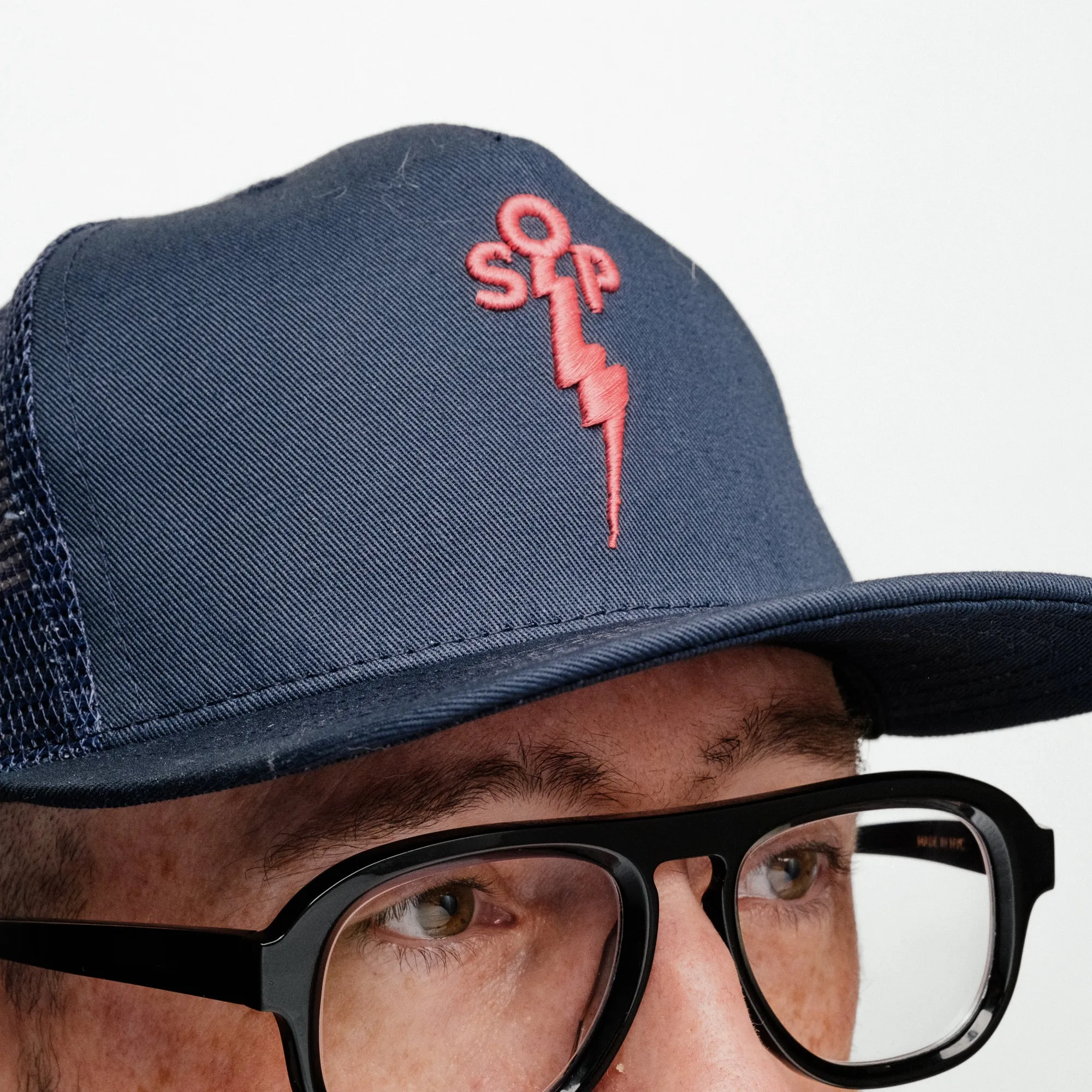 Snake Oil Provisions Embroidered Lightning Bolt Trucker Hat Navy/ Magenta