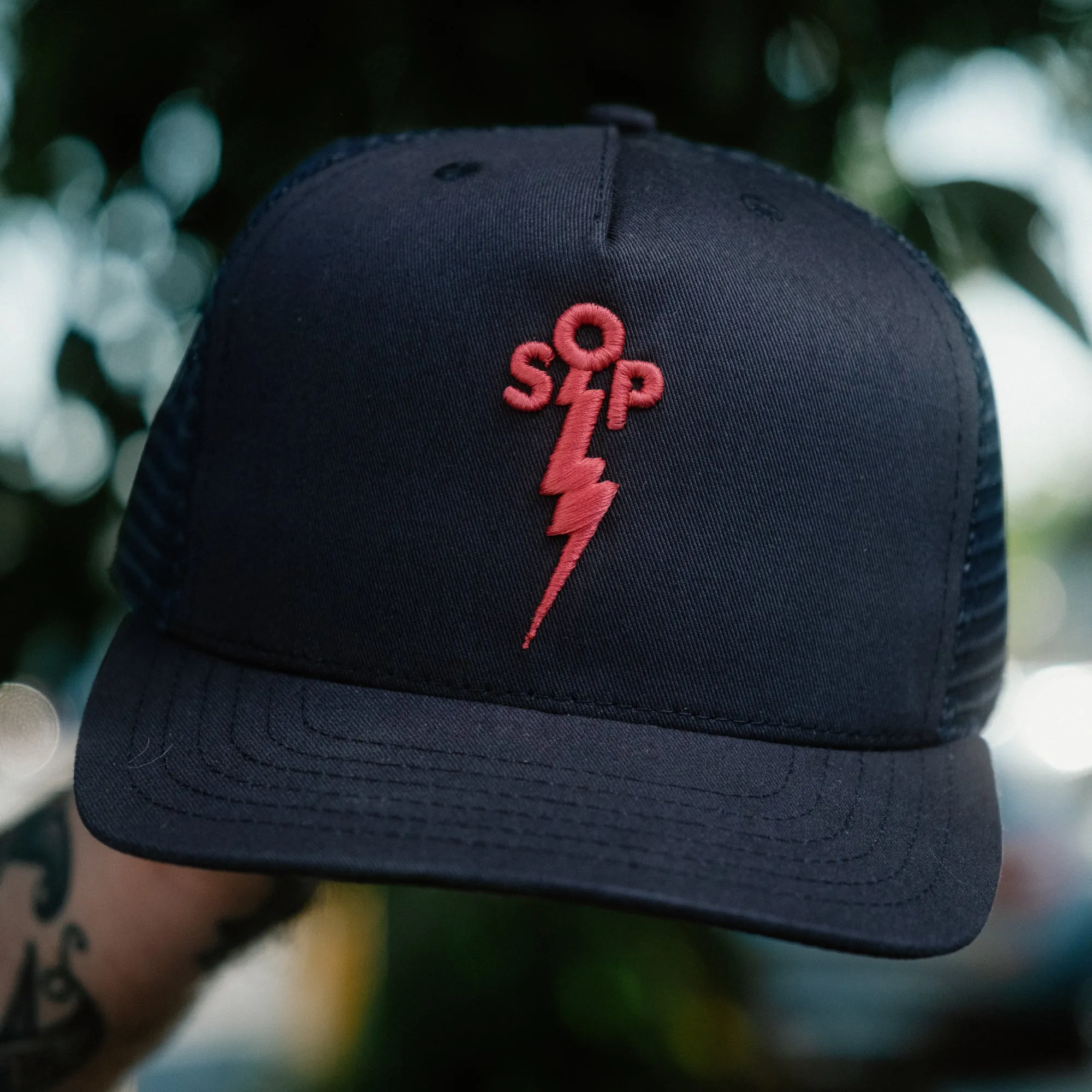 Snake Oil Provisions Embroidered Lightning Bolt Trucker Hat Navy/ Magenta